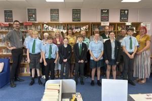 Back row:  teacher Robert Dale, Rotarian Jim Anderson. volunteers Ann Etheridge, Sarah Laidlaw and Alison Lowles, Rotarians Frank Thompson, Paul Vaesen, Geoff Lowles, David Pattenden and teacher Charlotte Davis. Front row:  Reading and Maths students